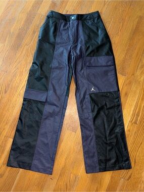 Women’s black and purple Jordan leather cargo pants